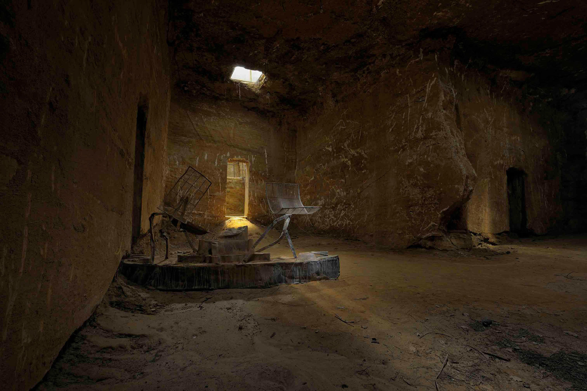 Large undergorund room with a sculpture by Anslem Kiefer